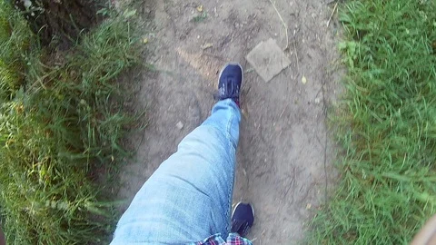 4K Man walking on the road. Top view of legs. gopro Stock Footage 91587286