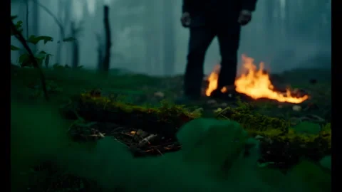 4K Man Walks by Fire In Forest, Camping In Woods At Night Video stock 278622868