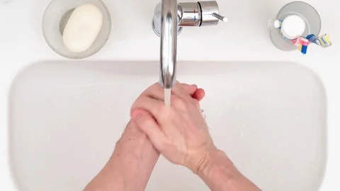 4K - Man washes hands. Top view Stock Footage 127994589