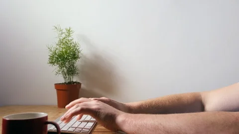 4K Man working late at night in office on computer whilst drinking coffee Stock Footage 88245246