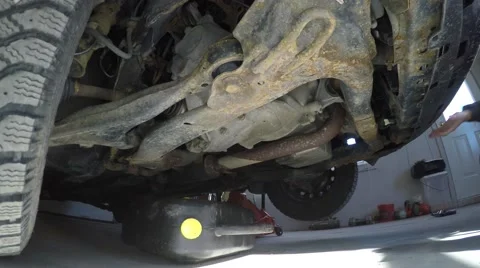 4k man working underneath his car Stock Footage 61419382