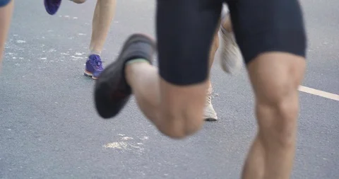 4K - Marathon Runners Legs Stock Footage 110800542