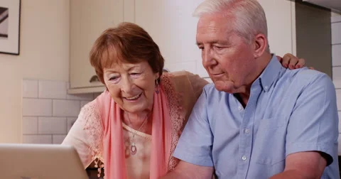 4k, Mature couple browsing the internet together on a laptop. Stock Footage 67190177