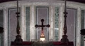 4k Mausoleum altar crucifix zoom out indoors with visitors 4k or 4k+ Resolution