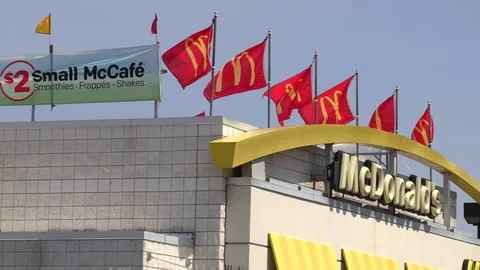 4K McDonalds rooftop flags display Video stock 90931811
