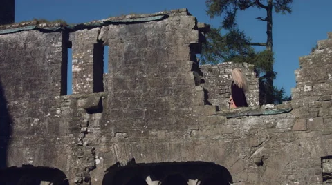 4k Medieval Shot of Game of Thrones Style Queen Walking in Ruins of Castle Stock Footage 67332752