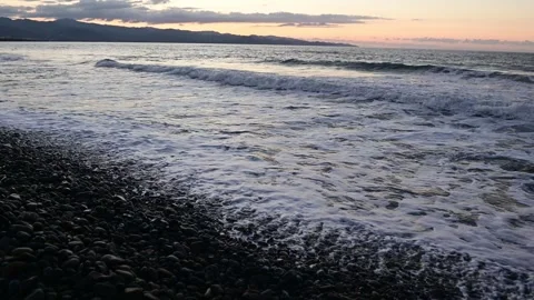 4k Mediterranean coast waves sunset stones  Stock Footage 255857400