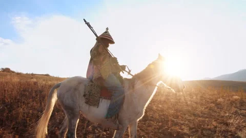 4k medium of an old African herder/ horse man riding his white horse on the grea Stock Footage 199616054