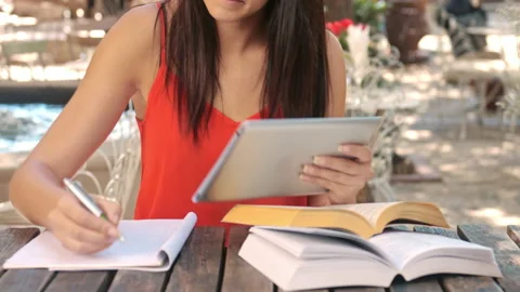 4k medium shot of casually dressed woman student with tablet computer doing home Stock Footage 201097165