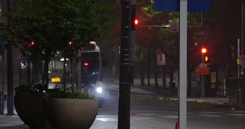 4K MEDIUM SHOT OF CITY BUS AT NIGHT Stock Footage 131127212