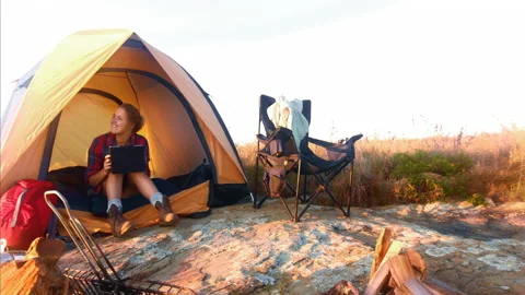 4k Medium shot of epic young traveler woman using a tablet whilst chilling in he Stock-Footage 201095225