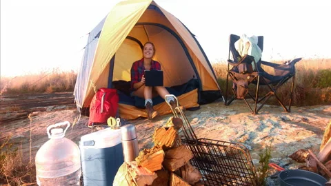 4k Medium shot of epic young traveler woman using a tablet whilst chilling in he Stock Footage 201095557