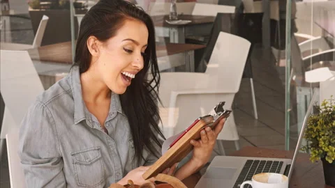 4k medium video of casual Latin Hispanic woman, calling for waiter and paying fo Stock Footage 201097091