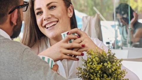 4k medium video of multicultural dating couple, being affectionate and drinking Stock Footage 201094336