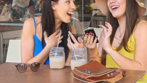 4k medium video of multicultural woman friends using smartphones and drinking ic Stock-Footage 201095569