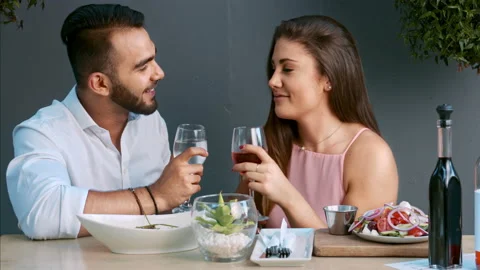 4k medium video of multiracial happy and romantic couple making a toast as its t Stock-Footage 201094092