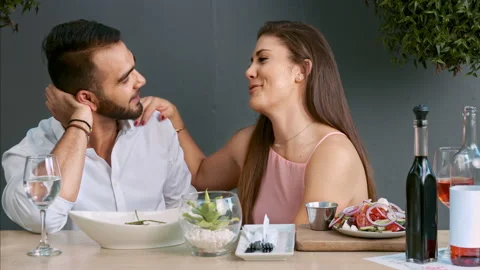 4k medium video of multiracial happy and romantic couple having dinner on date i Stock Footage 201096524