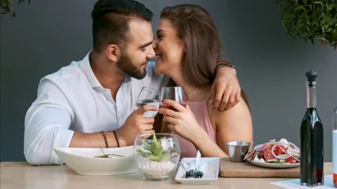 4k medium video of multiracial happy and romantic couple making a toast as its t Stock Footage 201096918