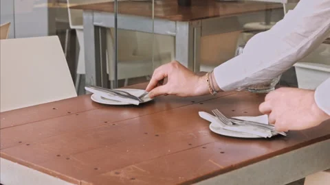 4k medium video of waiters setting the table for new customers in local cafe res Stock Footage 201097172