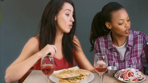4k medium video of women, multicultural friends being served gourmet dishes and Stock Footage 201095242