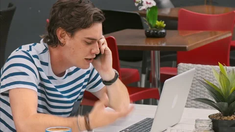 4k medium video of young and frustrated casual man answering call, while catchin Stock Footage 201096055