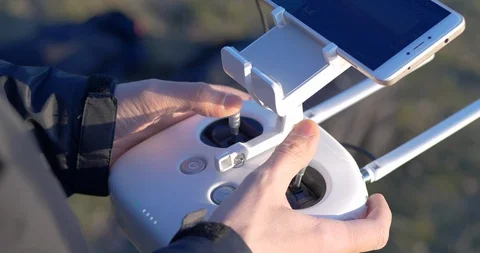 4K - Men hands controlling drone with remote control Stock Footage 106664602