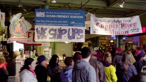 4K Men selling fish at Pikes Places market in Seattle Washington during day Stock Footage 73503258