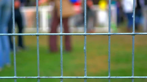 4K Mesh Wire Fence at Music Festival Concert, Crowd Background Stock Footage