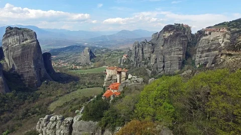 4K. Meteora rocks, Greece. View to valley of Thessaly with monasteries on cliff. 動画素材 106035341