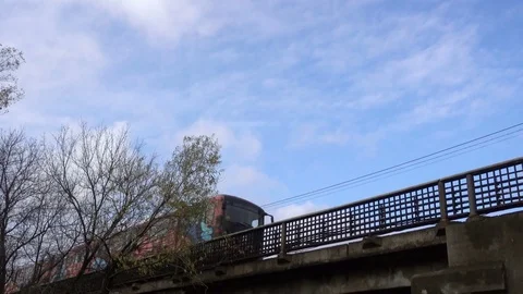 4k Metro train going over the bridge Video stock 82417793