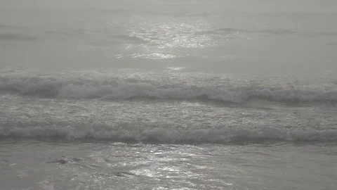 4K Misty ocean wave rolling in autumn day foggy sunlight bright sea water foam Stock Footage 80073140