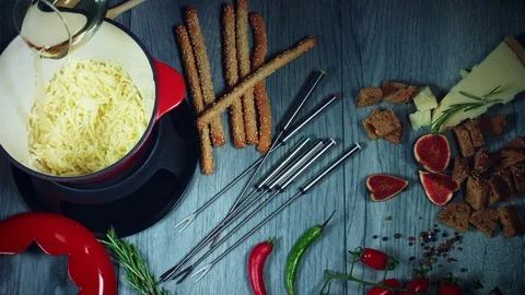 4k Mixed Cheese Fondue Adding Wine Stock Footage