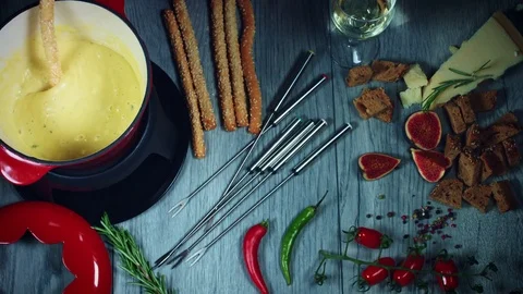 4k Mixed Cheese Fondue Dipping Bread Stick Stock Footage