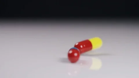4K Mixture of colourful medication falling on white surface Stock Footage 70822319