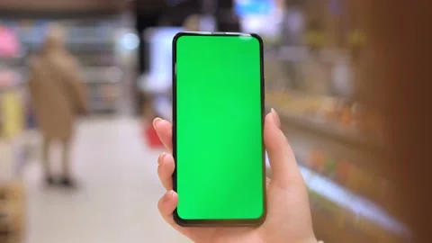 4k Mobile phone Chroma key for mobile app application. Close up of woman hand Stock Footage 233501606