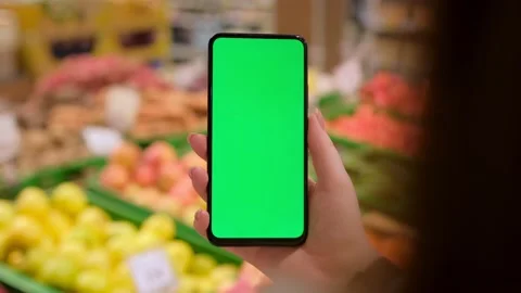 4k Mobile phone Chroma key for mobile app application. Close up of woman hand Video stock 234259532
