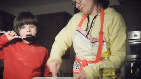 4k Mom and Son Baking Cake Stock Footage 86092955