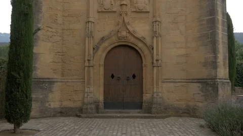 4K Monasterio Poblet exterior ermita church chapel gate door Stock Footage 116539471