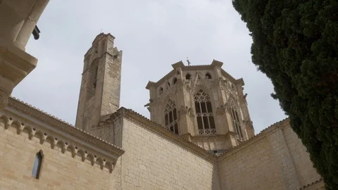 4K Monasterio Poblet exterior tower bell low sun torre Stock Footage 116539712