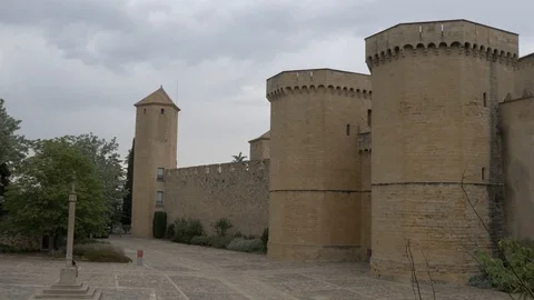 4K Monasterio Poblet exterior wall towers stone fort castle Stock Footage 116539965