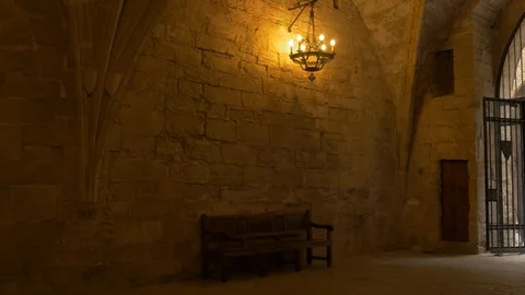 4K Monasterio Poblet interior fire light seat entrada door Stock Footage 116540366