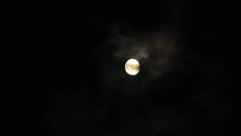 4k Moon in cloudy night sky close up video Stock Footage 93927276