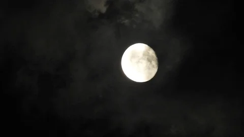 4k Moon in cloudy night sky close up video Stock Footage 93927577