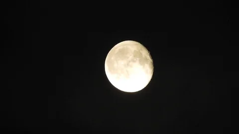 4k Moon in cloudy night sky close up video Stock Footage 93927608