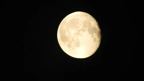 4k Moon in cloudy night sky close up video Stock Footage 93927656
