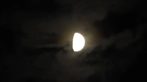 4k Moon in cloudy night sky close up video Stock Footage 93928673