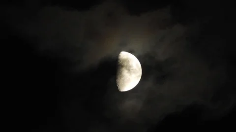 4k Moon in cloudy night sky close up video Stock Footage 93928686
