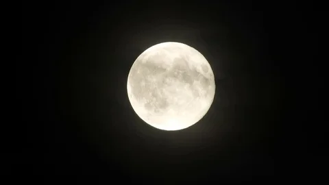 4k Moon in cloudy night sky close up video Stock Footage 93928708