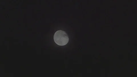 4k moon timelapse (waning gibbous) with clouds passing by Stock Footage