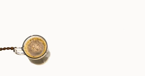 4k Motion Design. A cup of coffee draws a line of life with coffee beans Stock Footage 126561857
